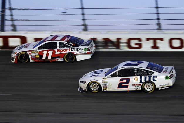 Apr 12, 2014; Darlington, SC, USA; NASCAR Sprint Cup driver Denny Hamlin (11) and NASCAR Sprint Cup driver Brad Keselowski (2) during the Southern 500 at Darlington Raceway. Mandatory Credit: Peter Casey-USA TODAY Sports