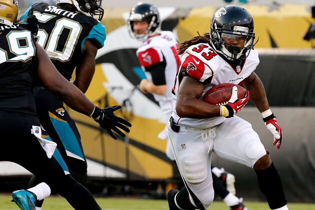 JACKSONVILLE, FL - AUGUST 28: Devonta Freeman #33 of the Atlanta Falcons carries during the first half of the game against the Jacksonville Jaguars at EverBank Field on August 28, 2014 in Jacksonville, Florida.  (Photo by Rob Foldy/Getty Images)
