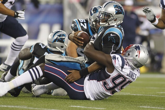 Aug 22, 2014; Foxborough, MA, USA; New England Patriots defensive end Chandler Jones (95) sacks Carolina Panthers quarterback Cam Newton (1) during the first quarter at Gillette Stadium. Mandatory Credit: Stew Milne-USA TODAY Sports
