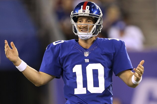 New York Giants quarterback Eli Manning reacts during the first half of an NFL preseason football game against the New England Patriots, Thursday, Aug. 28, 2014, in East Rutherford, N.J. (AP Photo/John Minchillo)