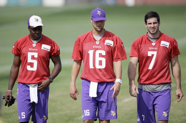 Minnesota Vikings quarterbacks, from left, Teddy Bridgewater, Matt Cassel and Christian Ponder walk to the field before an NFL football training camp practice, Friday, Aug. 1, 2014, in Mankato, Minn. (AP Photo/Charlie Neibergall)