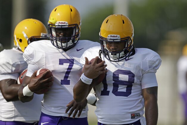 LSU running back Terrence Magee (18) and running back Leonard Fournette (7) run through drills during their NCAA college football practice in Baton Rouge, La., Wednesday, Aug. 6, 2014. (AP Photo/Gerald Herbert)