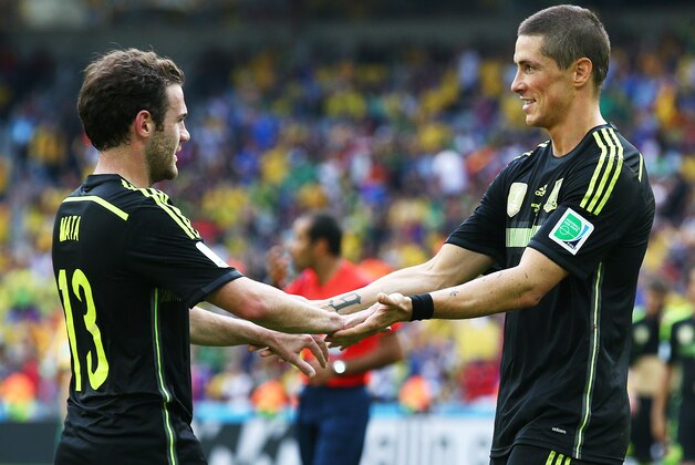 CURITIBA, BRAZIL - JUNE 23: Juan Mata of Spain (L) celebrates scoring his team's third goal with Fernando Torres during the 2014 FIFA World Cup Brazil Group B match between Australia and Spain at Arena da Baixada on June 23, 2014 in Curitiba, Brazil.  (Photo by Ian Walton/Getty Images)