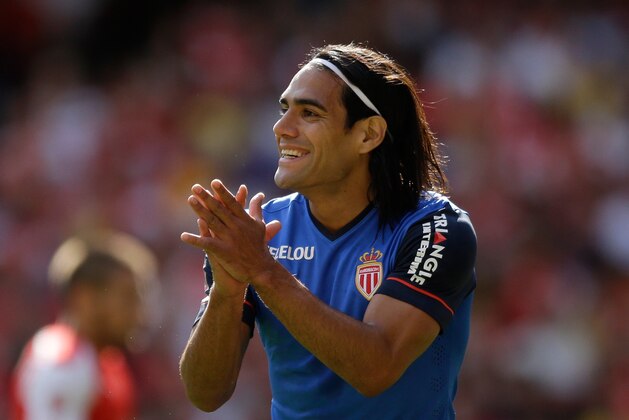 AS Monaco's Radamel Falcao applauds a teammate during the Emirates Cup soccer match between Arsenal and AS Monaco at Arsenal's Emirates Stadium, London, Sunday, Aug. 3, 2014.  (AP Photo/Matt Dunham)