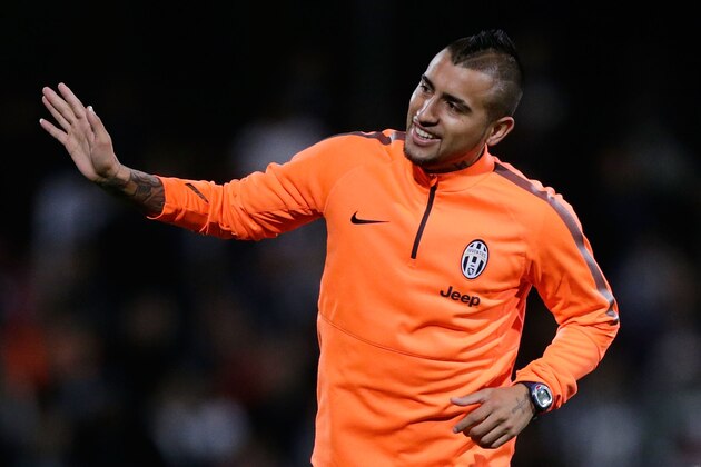 SYDNEY, AUSTRALIA - AUGUST 09:  Arturo Vidal waves to fans during a Juventus training session at WIN Jubilee Stadium on August 9, 2014 in Sydney, Australia.  (Photo by Mark Metcalfe/Getty Images)