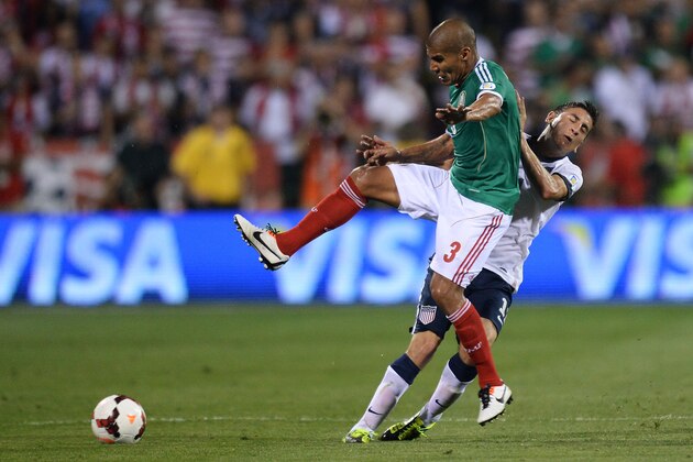COLUMBUS, OH - SEPTEMBER 10:  Carlos Salcido #3 of the Mexico Men's National Team and Alejandro Bedoya #11 of the United States MenÕs National Team collide while battling for control of the ball in the second half at Columbus Crew Stadium on September 10, 2013 in Columbus, Ohio. The United States defeated Mexico 2-0 and qualified for the World Cup.  (Photo by Jamie Sabau/Getty Images)
