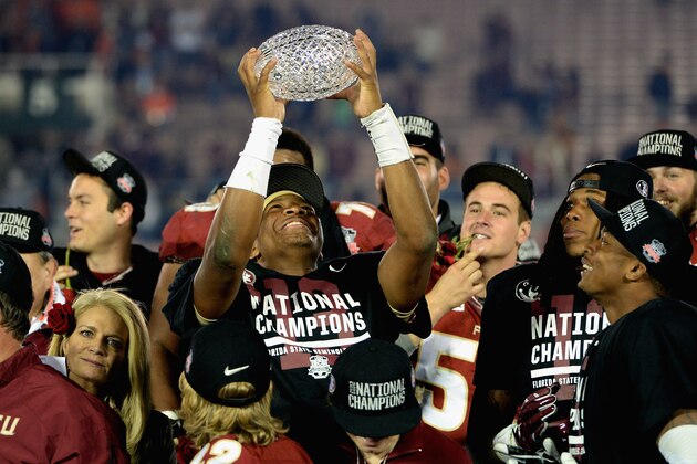 PASADENA, CA - JANUARY 06:  Quarterback Jameis Winston #5 of the Florida State Seminoles holds the Coaches' Trophy after defeating the Auburn Tigers 34-31 in the 2014 Vizio BCS National Championship Game at the Rose Bowl on January 6, 2014 in Pasadena, California.  (Photo by Harry How/Getty Images)