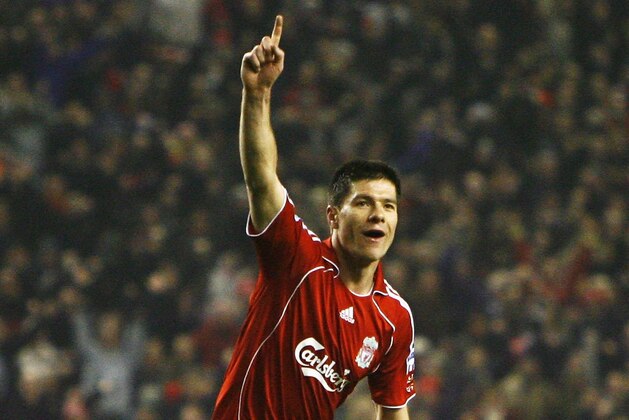 LIVERPOOL, UNITED KINGDOM - DECEMBER 23:  Xabi Alonso of Liverpool celebrates scoring his team's second goal during the Barclays Premiership match between Liverpool and Watford at Anfield on December 23, 2006 in Liverpool, England.  (Photo by Clive Brunskill/Getty Images)