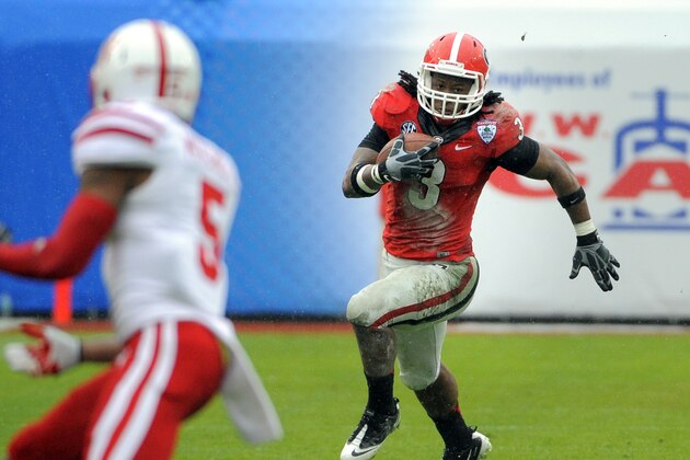 Georgia running back Todd Gurley (3) runs for yardage during the first half of the Gator Bowl NCAA college football game against Nebraska, Wednesday, Jan. 1, 2014, in Jacksonville, Fla. (AP Photo/Stephen B. Morton)