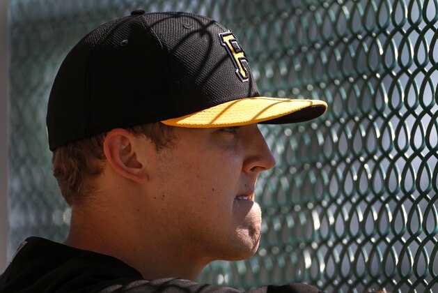 Pittsburgh Pirates pitcher Jameson Taillon waits his turn to throw against hitters during the team's baseball spring training workout in Bradenton, Fla., Thursday, Feb. 20, 2014. (AP Photo/Gene J. Puskar)