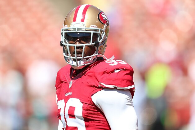 SAN FRANCISCO, CA - SEPTEMBER 22:  Aldon Smith #99 of the San Francisco 49ers looks on during warm-ups against the Indianapolis Colts at Candlestick Park on September 22, 2013 in San Francisco, California.  (Photo by Jed Jacobsohn/Getty Images)