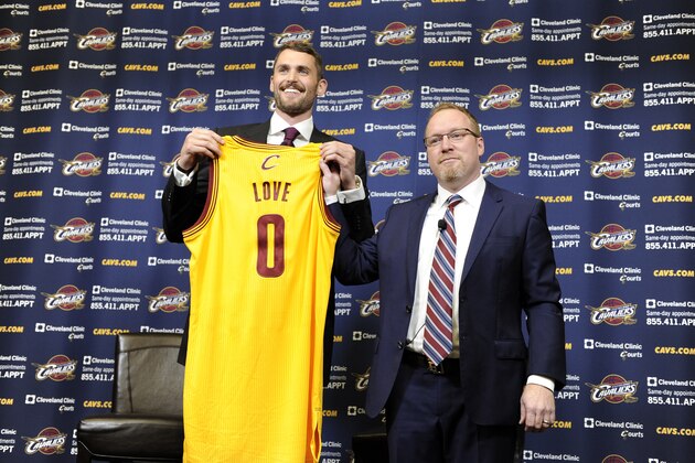 INDEPENDENCE, OH - AUGUST 26:  Kevin Love #0 of the Cleveland Cavaliers holds up his new jersey as he is introduced to the media alongside General Manager David Griffin at The Cleveland Clinic Courts on August 26, 2014 in Independence, Ohio in Cleveland, Ohio. NOTE TO USER: User expressly acknowledges and agrees that, by downloading and/or using this Photograph, user is consenting to the terms and conditions of the Getty Images License Agreement. Mandatory Copyright Notice: Copyright 2014 NBAE (Photo by David Liam Kyle/NBAE via Getty Images)