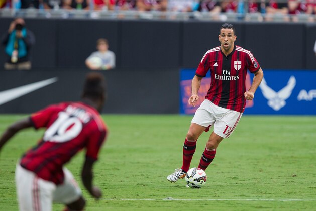 CHARLOTTE, NC - AUGUST 02: Adil Mai #13 of A.C. Milan passes the ball during first half action against Liverpool in the Guinness International Champions Cup at Bank of America Stadium on August 2, 2014 in Charlotte, North Carolina. Liverpool defeated A.C. Milan 2-0. (Photo by Brian A. Westerholt/Getty Images)