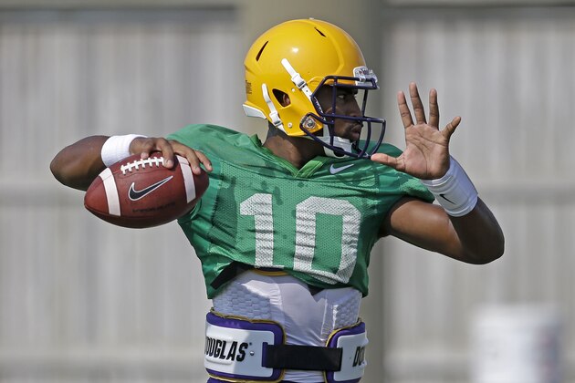 FILE - In this Aug. 6, 2014, file photo, LSU quarterback Anthony Jennings (10) passes during their NCAA college football practice in Baton Rouge, La. Tigers coach Les Miles has declared that he will use both sophomore Jennings and freshman Brandon Harris. (AP Photo/Gerald Herbert, File)