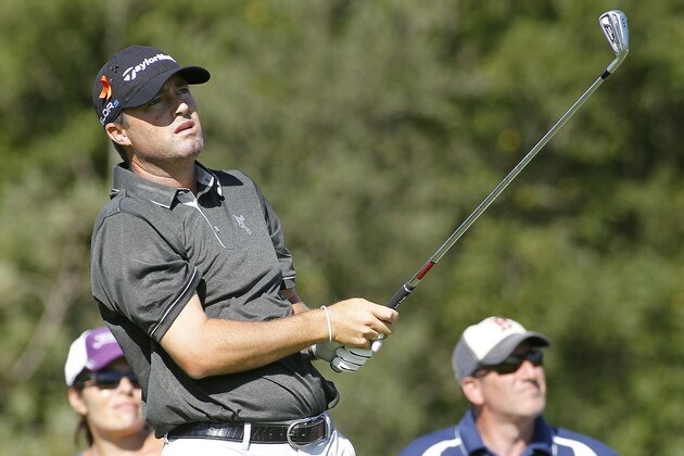 Ryan Palmer watches his tee shot on the third hole during the first round of the Deutsche Bank Championship golf tournament in Norton, Mass., Friday, Aug. 29, 2014. (AP Photo/Stew Milne)