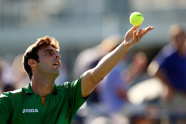NEW YORK, NY - AUGUST 29:  Marcel Granollers of Spain serves against Ivo Karlovic of Croatia during their men's singles second round match on Day Five of the 2014 US Open at the USTA Billie Jean King National Tennis Center on August 29, 2014 in the Flushing neighborhood of the Queens borough of New York City.  (Photo by Elsa/Getty Images)
