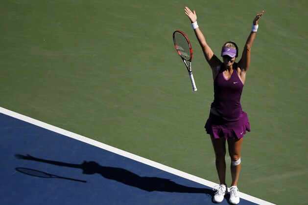 Mirjana Lucic-Baroni, of Croatia, reacts after defeating Simona Halep, of Romania, during the third round of the 2014 U.S. Open tennis tournament, Friday, Aug. 29, 2014, in New York. (AP Photo/Elise Amendola)
