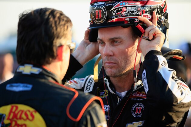 HAMPTON, GA - AUGUST 29:  Kevin Harvick (R), driver of the #4 Jimmy John's Chevrolet, talks to Tony Stewart, driver of the #14 Bass Pro Shops / Mobil 1 Chevrolet, on the grid during qualifying for the NASCAR Sprint Cup Series Oral-B USA 500 at Atlanta Motor Speedway on August 29, 2014 in Hampton, Georgia.  (Photo by Jamie Squire/Getty Images)