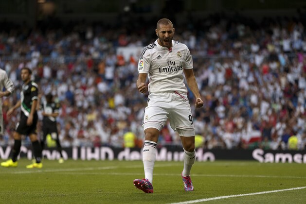 Real Madrid's Karim Benzema from France, celebrates his goal during a Spanish La Liga soccer match between Real Madrid and Cordoba at the Santiago Bernabeu stadium in Madrid, Spain, Monday, Aug. 25, 2014 . (AP Photo/Daniel Ochoa de Olza)