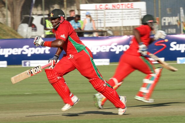 Zimbabwean batsman Hamilton Masakadza, left,  makes a run  on the first  cricket ODI  against  Australia at Harare Sports Club in  Harare Zimbabwe Monday, Aug. 25, 2014. The Australian is in Zimbabwe for a triangular  ODI series with Zimbabwe and South Africa. (AP Photo/Tsvangirayi Mukwazhi)