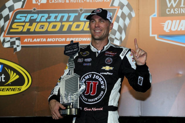 HAMPTON, GA - AUGUST 29:  Kevin Harvick, driver of the #4 Jimmy John's Chevrolet, poses with the trophy after qualifying at the pole position for the NASCAR Sprint Cup Series Oral-B USA 500 at Atlanta Motor Speedway on August 29, 2014 in Hampton, Georgia.  (Photo by Mike Ehrmann/Getty Images)