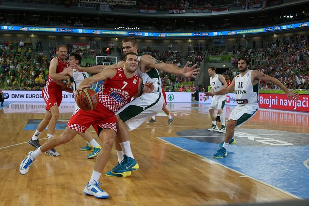 Lithuania's Robertas Javtokas, right, defends against Croatia's Bojan Bogdanovic during their EuroBasket European Basketball Championship semifinal match at the Stozice Arena, in Ljubljana, Slovenia, Friday, Sept. 20, 2013. (AP Photo/Thanassis Stavrakis)