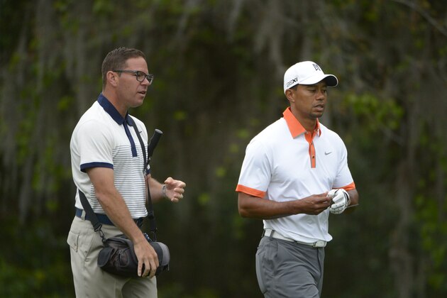 Coach Sean Foley, left, talks to Tiger Woods on the third fairway during the pro-am of the Arnold Palmer Invitational golf tournament in Orlando, Fla., Wednesday, March 20, 2013.(AP Photo/Phelan M. Ebenhack)