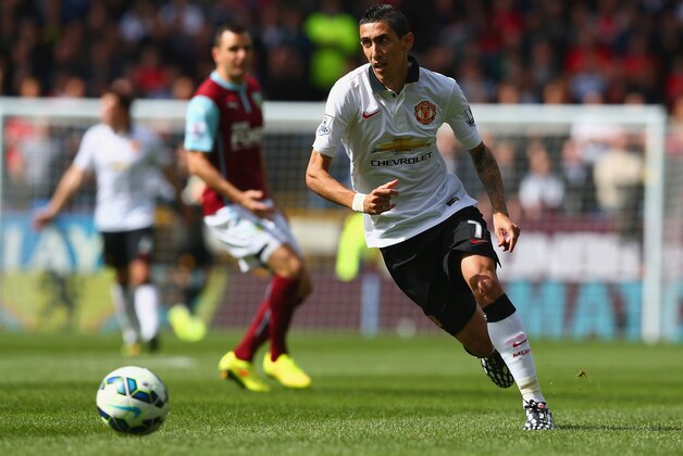 BURNLEY, ENGLAND - AUGUST 30: Angel di Maria of Manchester United runs with the ball during the Barclays Premier League match between Burnley and Manchester United at Turf Moor on August 30, 2014 in Burnley, England.  (Photo by Clive Brunskill/Getty Images)