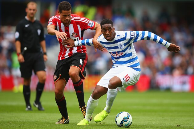 LONDON, ENGLAND - AUGUST 30:  Leroy Fer of QPR holds off Jack Rodwell of Sunderland during the Barclays Premier League match between Queens Park Rangers and Sunderland at Loftus Road on August 30, 2014 in London, England.  (Photo by Paul Gilham/Getty Images)