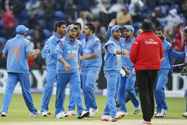 India's Suresh Raina, third left, celebrates with his teammates after they defeated England in their One Day International cricket match at the SWALEC cricket ground in Cardiff, Wales, Wednesday, Aug. 27, 2014. (AP Photo/Alastair Grant)