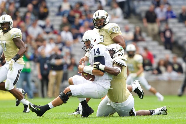 DUBLIN, IRELAND - AUGUST 30:   Penn State quarterback Christian Hackenberg #14 is sacked by Thomas Niles #69 of UCF during the Croke Park Classic American Football match between Penn State v Central Florida at Croke Park Stadium on August 30, 2014 in Dublin, Ireland.  (Photo by Patrick Bolger/Getty Images)
