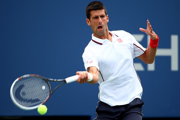 NEW YORK, NY - AUGUST 30:  Novak Djokovic of Serbia returns a shot against Sam Querrey of the United States during their men's singles third round match on Day Six of the 2014 US Open at the USTA Billie Jean King National Tennis Center on August 30, 2014 in the Flushing neighborhood of the Queens borough of New York City.  (Photo by Streeter Lecka/Getty Images)