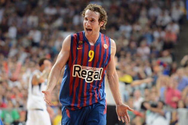 BARCELONA - OCTOBER 9: Marcelinho Huertas #9 of FC Barcelona Regal celebrates against the Dallas Mavericks during NBA Europe Live 2012 on October 9, 2012 at Palau Sant Jordi in Barcelona, Spain. NOTE TO USER: User expressly acknowledges and agrees that, by downloading and or using this photograph, User is consenting to the terms and conditions of the Getty Images License Agreement. Mandatory Copyright Notice: Copyright 2012 NBAE (Photo by Garrett W. Ellwood/NBAE via Getty Images)