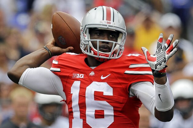 Ohio State quarterback J.T. Barrett throws to a receiver in the first half of an NCAA college football game against Navy in Baltimore, Saturday, Aug. 30, 2014. (AP Photo/Patrick Semansky)