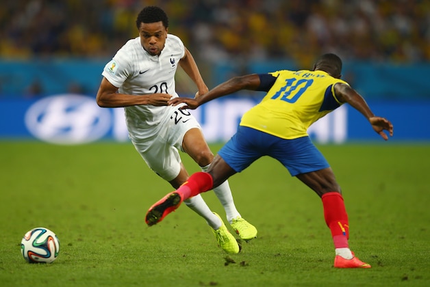 RIO DE JANEIRO, BRAZIL - JUNE 25: Loic Remy of France competes for the ball with Walter Ayovi of Ecuador during the 2014 FIFA World Cup Brazil Group E match between Ecuador and France at Maracana on June 25, 2014 in Rio de Janeiro, Brazil.  (Photo by Clive Rose/Getty Images)