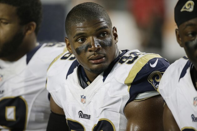 St. Louis Rams defensive end Michael Sam (96) sits on the sidelines during the first half of an NFL preseason football game against the Miami Dolphins, Thursday, Aug. 28, 2014 in Miami Gardens, Fla.  (AP Photo/Lynne Sladky)