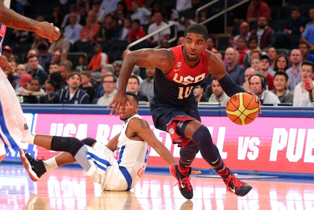 Aug 22, 2014; New York, NY, USA; United States guard Kyrie Irving (10) controls the ball in front of Puerto Rico forward Alexander Franklin (6) during the first quarter of a game at Madison Square Garden. Mandatory Credit: Brad Penner-USA TODAY Sports