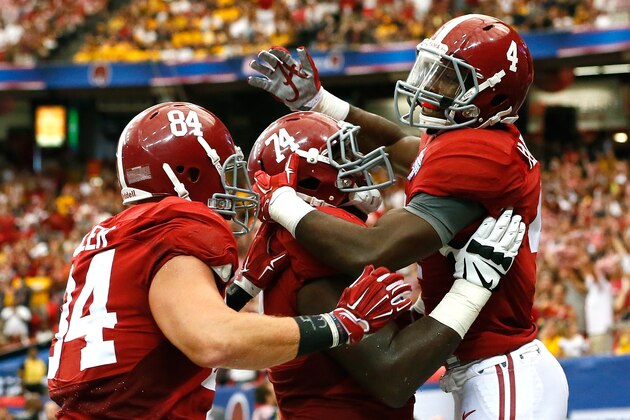ATLANTA, GA - AUGUST 30:  T.J. Yeldon #4 of the Alabama Crimson Tide celebrates a touchdown against the West Virginia Mountaineers with Brian Vogler #84 and Cam Robinson #74 at Georgia Dome on August 30, 2014 in Atlanta, Georgia.  (Photo by Kevin C. Cox/Getty Images)