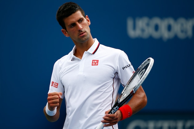 NEW YORK, NY - AUGUST 30:  Novak Djokovic of Serbia celebrates against Sam Querrey of the United States in their men's singles third round match on Day Six of the 2014 US Open at the USTA Billie Jean King National Tennis Center on August 30, 2014 in the Flushing neighborhood of the Queens borough of New York City.  (Photo by Julian Finney/Getty Images)