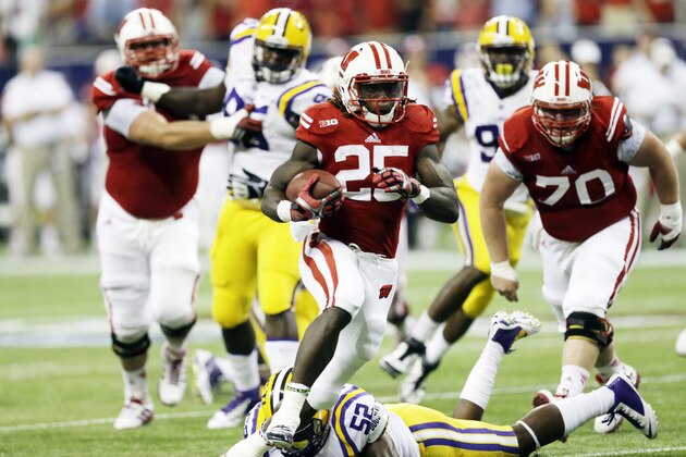 Wisconsin's Melvin Gordon runs for a 14-yard touchdown during the first half of an NCAA college football game against LSU Saturday, Aug. 30, 2014, in Houston. (AP Photo/David J. Phillip) Wisconsin's Melvin Gordon runs for a 14-yard touchdown during the first half of an NCAA college football game against LSU Saturday, Aug. 30, 2014, in Houston. (AP Photo/David J. Phillip)