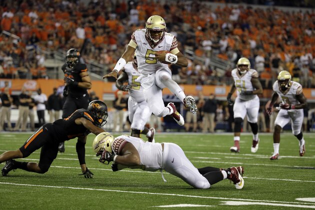 **RETRANSMISSION OF CBS118 FOR ALTERNATE CROP** Florida State quarterback Jameis Winston (5) leaps over guard Josue Matias, bottom, as Oklahoma State safety Jordan Sterns, left, is unable to stop Winston from reaching the end zone for a touchdown in the second half of an NCAA college football game, Saturday, Aug. 30, 2014, in Arlington, Texas. (AP Photo/Tony Gutierrez) **RETRANSMISSION OF CBS118 FOR ALTERNATE CROP** Florida State quarterback Jameis Winston (5) leaps over guard Josue Matias, bottom, as Oklahoma State safety Jordan Sterns, left, is unable to stop Winston from reaching the end zone for a touchdown in the second half of an NCAA college football game, Saturday, Aug. 30, 2014, in Arlington, Texas. (AP Photo/Tony Gutierrez)