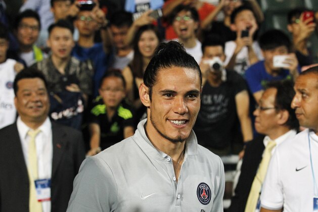 Paris Saint-Germain's Edinson Cavani gestures during a friendly match against Kitchee in Hong Kong Tuesday, July 29, 2014. (AP Photo/Kin Cheung)