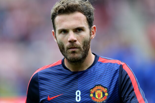 Manchester United's Juan Mata ahead of  their English Premier League soccer match against Sunderland at the Stadium of Light, Sunderland, England, Sunday, Aug. 24, 2014. (AP Photo/Scott Heppell)