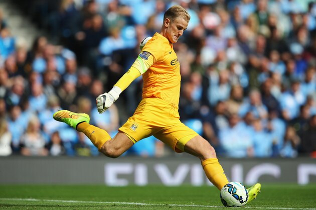 MANCHESTER, ENGLAND - AUGUST 30:  Joe Hart of Manchester City kicks down field during the Barclays Premier League match between Manchester City and Stoke City at Etihad Stadium on August 30, 2014 in Manchester, England.  (Photo by Clive Mason/Getty Images)