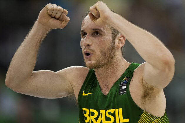 Brazil's Marcelinho Huertas gestures during the Group A Basketball World Cup match between Brazil and France in Granada, Spain, Saturday, Aug. 30, 2014. The 2014 Basketball World Cup competition will take place in various cities in Spain from Aug. 30 through to Sept. 14. (AP Photo/Daniel Tejedor)