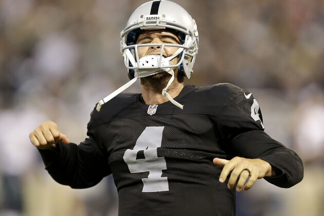 Oakland Raiders quarterback Derek Carr (4) reacts after the Raiders scored a touchdown during the first half of an NFL preseason football game against the Seattle Seahawks in Oakland, Calif., Thursday, Aug. 28, 2014. (AP Photo/Ben Margot)