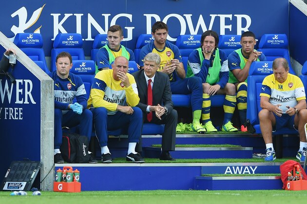 LEICESTER, ENGLAND - AUGUST 31: Arsene Wenger, manager of Arsenal sits in the dug out with assistant Steve Bould during the Barclays Premier League match between Leicester City and Arsenal at The King Power Stadium on August 31, 2014 in Leicester, England.  (Photo by Michael Regan/Getty Images)