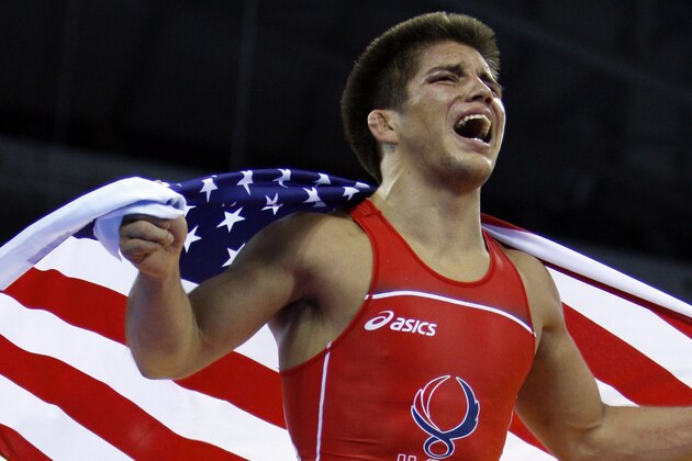USA's Henry Cejudo celebrates his gold in 55 kilogram freestyle wrestling division after defeating Japan's Tomohiro Matsunaga in their gold medal match at the Beijing 2008 Olympics in Beijing, Tuesday, Aug. 19, 2008.  (AP Photo/Ed Wray)