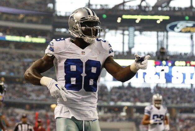 Aug 16, 2014; Arlington, TX, USA; Dallas Cowboys receiver Dez Bryant (88) celebrates a touchdown in the first quarter against the Baltimore Ravens at AT&T Stadium. Mandatory Credit: Matthew Emmons-USA TODAY Sports