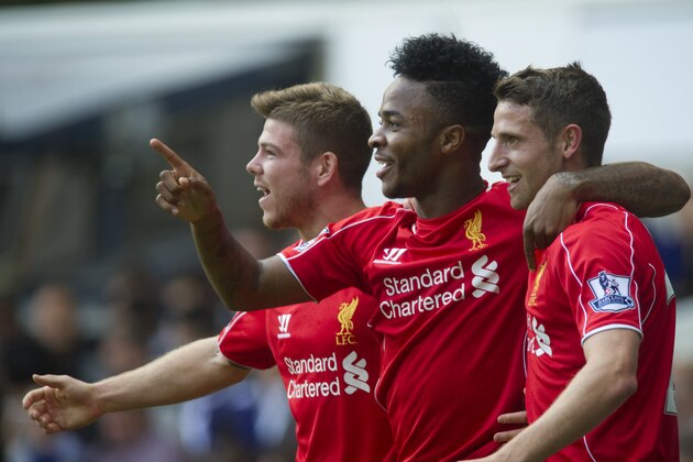 Liverpool's Raheem Sterling, center, celebrates with teammates Joe Allen, right, and Alberto Moreno after scoring against Tottenham Hotspur, during their English Premier League soccer match at White Hart Lane, London, Sunday, Aug. 31, 2014 (AP Photo/Bogdan Maran)